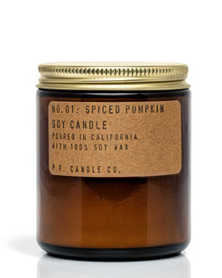 The Limited Edition Spiced Pumpkin soy candle in a glass jar with a gold lid on a white background