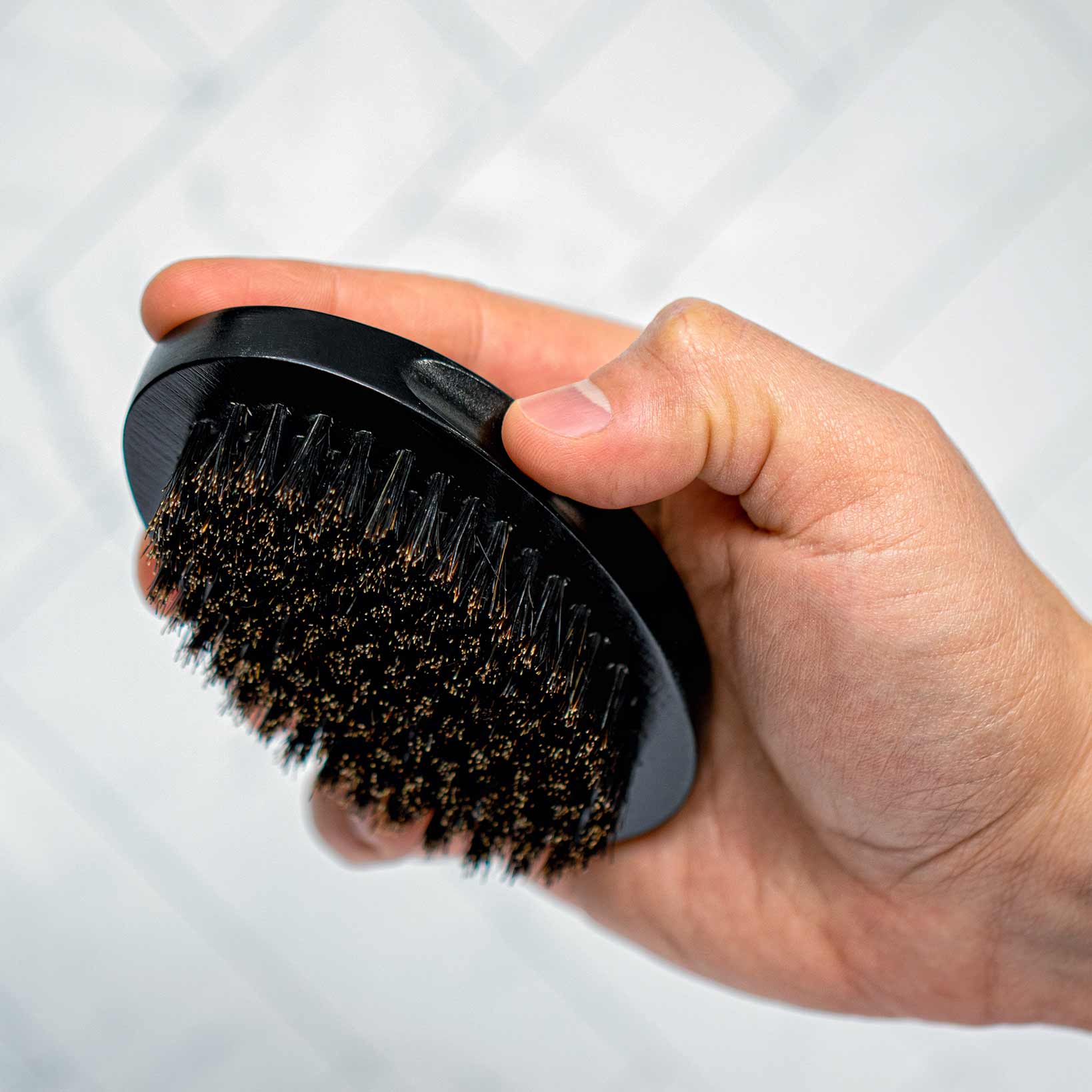 https://www.thekingsofstyling.com/cdn/shop/products/The-Kings-of-Styling-Small-Black-Oval-Beard-Brush.jpg?v=1669145633